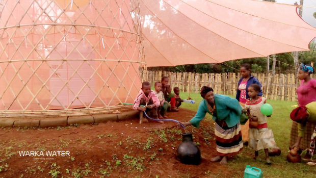 People gathering around a WarkaWater prototype in Addis Ababa, 2015. Image courtesy of WarkaWater.org